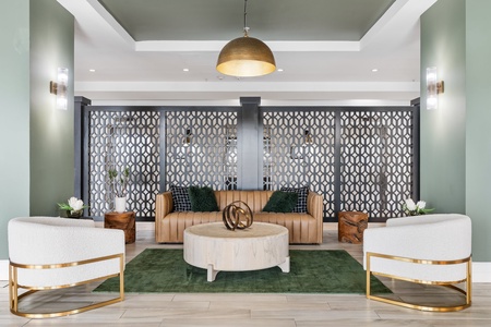 The ground floor features creative lounge areas designed for relaxation, along with a pool table to enjoy some casual play.