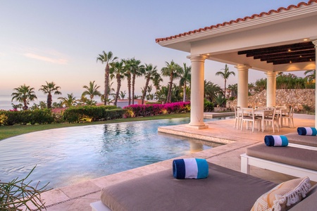 Outdoor Area with an infinity pool and view of the ocean.