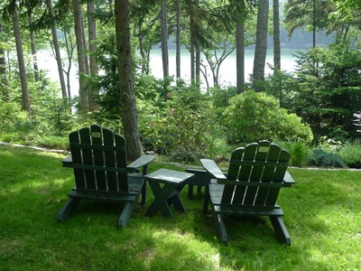 Lawn and sitting area overlooking water