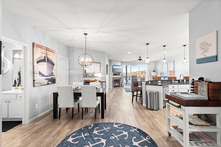 Your open-concept kitchen flows seamlessly into the dining area, creating perfect spaces for cooking and gathering together.