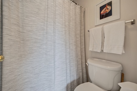 Refresh in your private bathroom with plush towels and modern touches after a day exploring the area.