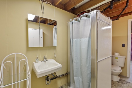 Your private bathroom features a refreshing shower, clean sink, and all essentials for a comfortable stay in this charming space.