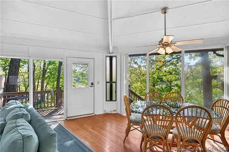 Step into your bright lakeside retreat with stunning water views, where every meal becomes a serene experience surrounded by nature's beauty framed by floor-to-ceiling windows.