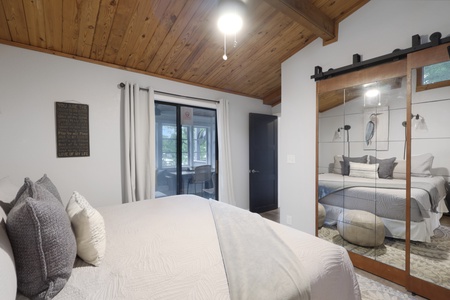 Drift off under the warmth of wood-beamed ceilings, surrounded by plush bedding and modern farmhouse charm that makes every night feel like a restful retreat.