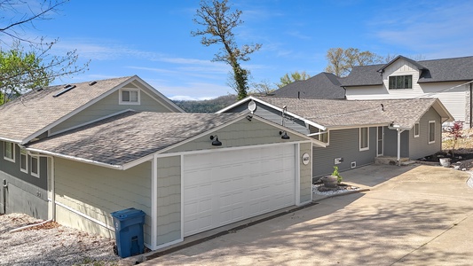Modern vacation home nestled in a peaceful hillside neighborhood with convenient garage parking and mountain views.