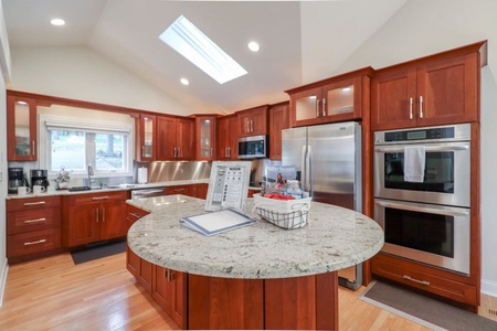 Fully stocked kitchen! Double ovens~ large fridge and a true focal point of the home!