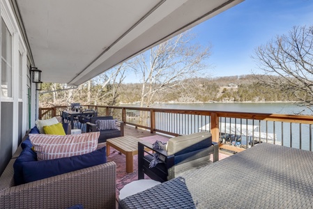 Relax on your private lakefront deck with comfortable seating and breathtaking water views stretching across the peaceful lake.