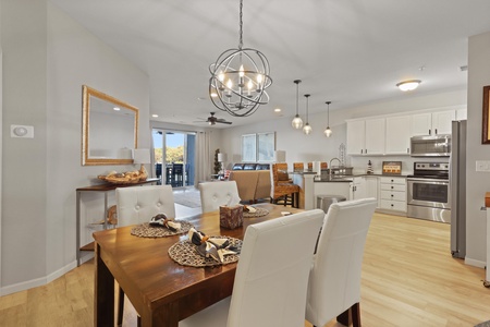 Your open-concept living space flows seamlessly from kitchen to dining, perfect for gathering with loved ones over home-cooked meals.