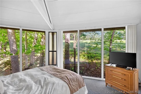 Wake up to sunlight filtering through towering trees just beyond your windows. Your private retreat feels like a peaceful woodland escape, blending indoor comfort with nature's beauty.