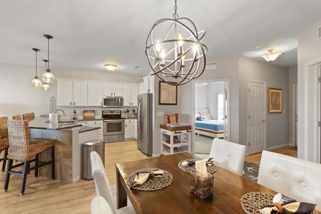 Your stylish open-concept space seamlessly blends the dining area and modern kitchen, creating the perfect setting for memorable meals together.