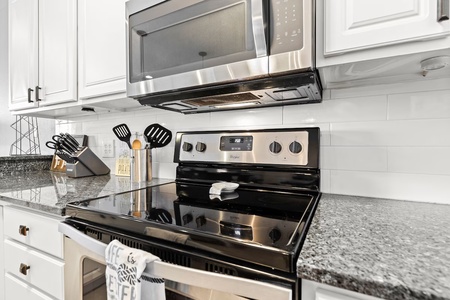 Your fully equipped kitchen features modern stainless steel appliances and granite countertops, perfect for preparing memorable meals during your stay.