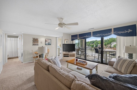 Sink into plush sofas in your bright, welcoming living room, where ceiling fans keep you cool and charming décor makes you feel right at home. Step out to your private balcony for fresh air and lovely neighborhood views.
