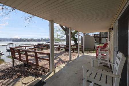 Your private covered patio features lake views and peaceful outdoor seating perfect for morning coffee or evening relaxation.