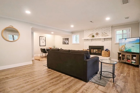 Lower level seating area- sofa bed and gaming area