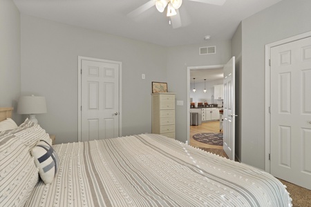 Sink into soft linens and wake up refreshed in your peaceful bedroom with convenient access to the kitchen.