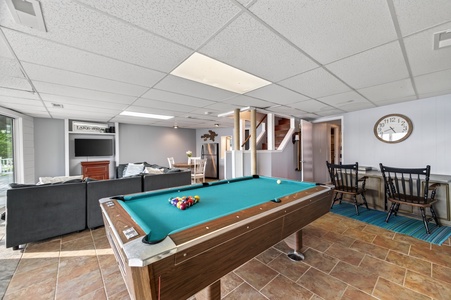 Challenge your friends to a friendly game of pool in this welcoming entertainment space, complete with a lounge area for relaxing between rounds.