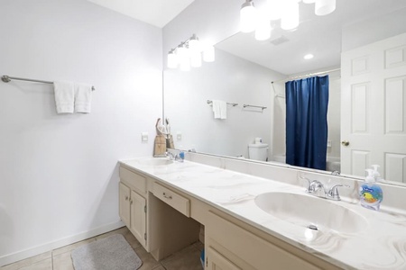 Full bathroom off guest bedroom 2. Includes 2 sinks and shower/tub combo