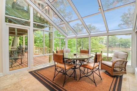 Enjoy your morning coffee or watch to clouds pass from the sunroom on the lower level. Great area for family game night!