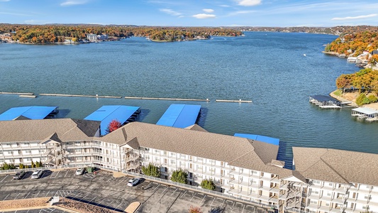 Waterfront resort property with marina access and fall foliage surrounding the peaceful lake.