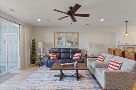 Unwind in your stylish living space with comfortable seating and nautical touches that create the perfect coastal retreat atmosphere.