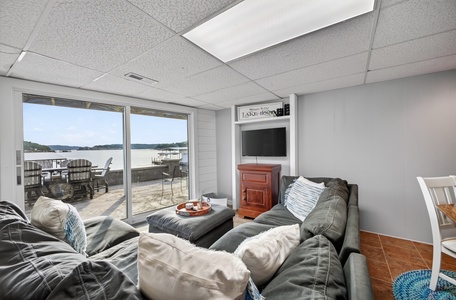 Sink into plush seating and soak up stunning lake views through floor-to-ceiling windows. Your own private dock awaits just beyond the doors, perfect for morning coffee or sunset moments.