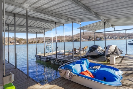 Step onto your private dock where lake adventures await - kayak at your leisure or simply relax in the chairs overlooking pristine waters.