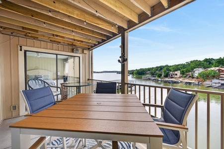 Picture yourself relaxing on your private covered deck, savoring morning coffee or evening cocktails with serene lake and marina views stretching before you—your peaceful waterfront escape awaits.