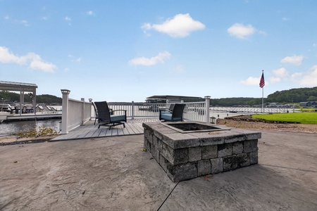 Gather around the fire pit on your private lakeside patio, where serene water views and quiet evenings await you under open skies.