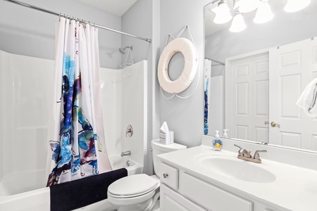 Step into your bright, clean bathroom featuring a full tub-shower combo and modern vanity for your comfort.