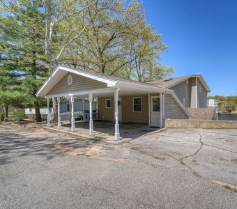 Fit up to 3 cars on this parking pad just to the right of the house.