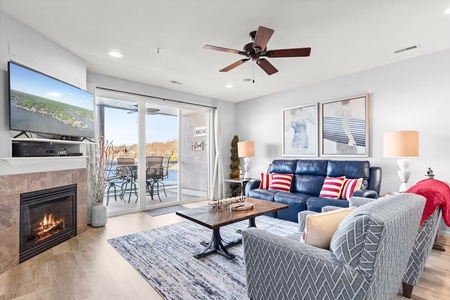 Unwind in your inviting living room with cozy fireplace, stylish furnishings, and sliding doors opening to your private outdoor space.
