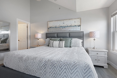 Your peaceful bedroom retreat features soft coastal tones and thoughtful touches, creating the perfect space to unwind after your adventures.