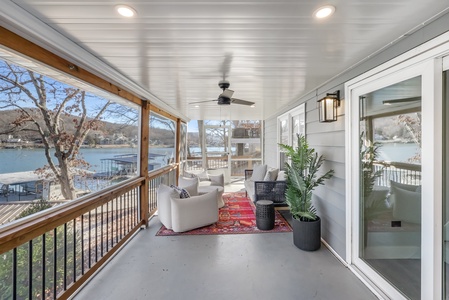 Your private covered porch offers comfortable seating with stunning lake views, perfect for morning coffee or evening relaxation.