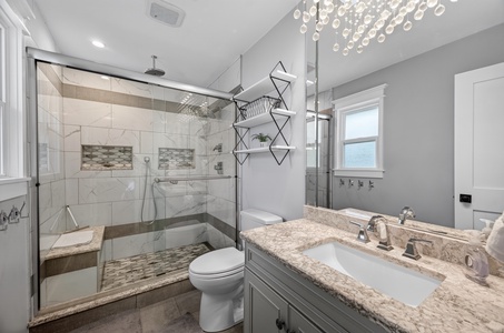 Step into your private spa-like retreat, complete with a spacious walk-in shower, elegant fixtures, and modern finishes that invite you to unwind in style after a day of adventure.