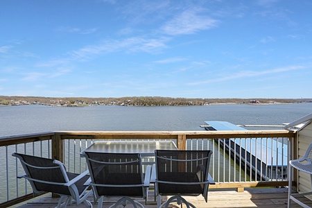 Relax in waterfront seating while enjoying panoramic lake views from your private deck.
