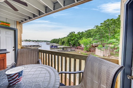 Sip your morning coffee on this private balcony while soaking in serene lake views and lush greenery—your peaceful retreat awaits just beyond the door.