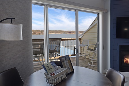 Step onto your private lakefront balcony where peaceful waters and cozy seating create the perfect retreat for morning coffee or sunset relaxation.