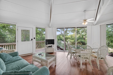 Relax in your airy sunroom with serene garden views, comfy seating, and a cozy dining nook—perfect for morning coffee or sunset cocktails.
