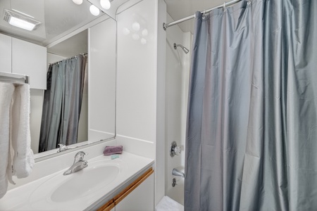 Freshen up in your private bathroom, complete with a tub-shower combo, crisp linens, and everything you need to feel right at home.