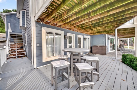 Your private deck invites you to dine alfresco under a wood pergola with a hot tub just steps away, perfect for sunset soaks and morning coffee rituals.