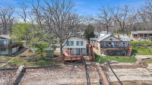 Charming lakeside retreat with private dock and multilevel decks overlooking peaceful waters.