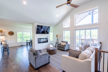 1st floor Living Room with electric fireplace and beautiful views of the lake