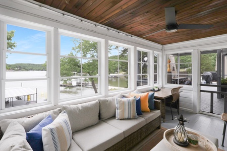 Relax in your bright sunroom with sweeping lake views and comfortable seating—perfect for morning coffee or unwinding after a day on the water.