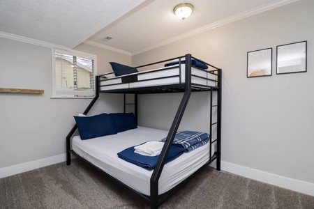Guest Bedroom downstairs with Full lower bunk and twin upper bunk