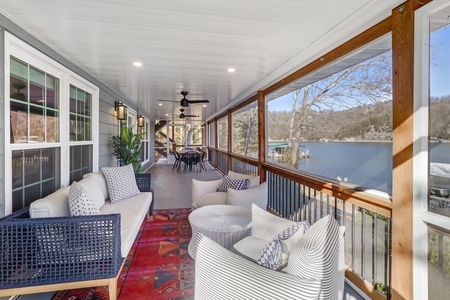 Relax on your private covered deck with stunning lake views, comfortable seating, and peaceful waterfront moments.