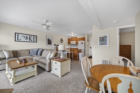 Settle into this inviting open-concept space where your living and dining areas flow seamlessly together. Relax on the plush sectional, gather around the dining table, and enjoy the comfort of your home-away-from-home.
