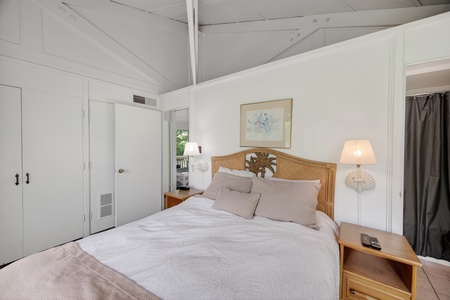 Unwind in your private retreat featuring a plush queen bed, coastal-inspired décor, and soaring ceilings that create an airy, tranquil ambiance perfect for restful nights.