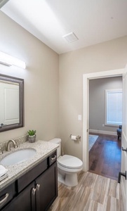 Shared full bathroom off the kitchen and queen bedroom