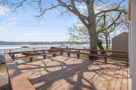 Step onto your private deck where lake breezes and dappled shade create the perfect spot for morning coffee or evening relaxation.