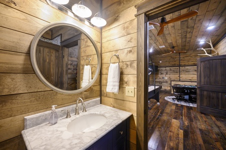 Full bathroom upstairs with tub/shower combo services the bunk and game rooms